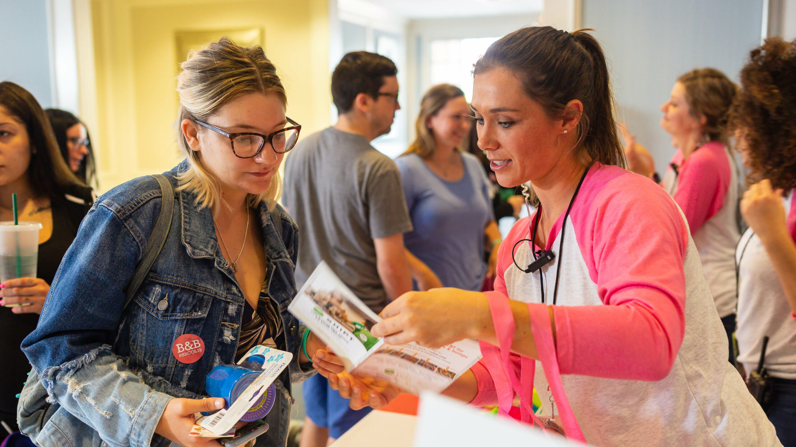 event staff helping attendee