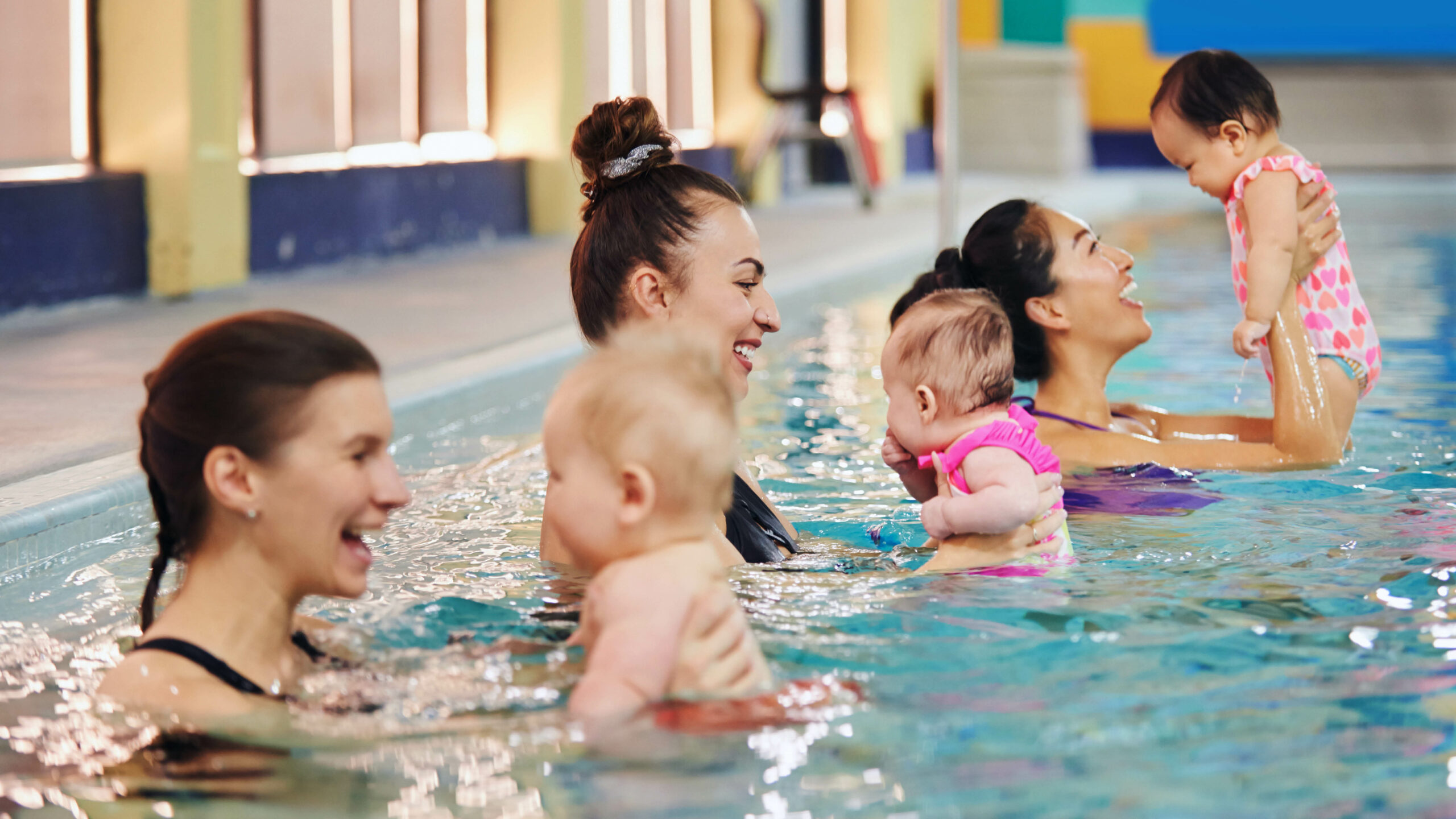 Moms and babies at swimming class
