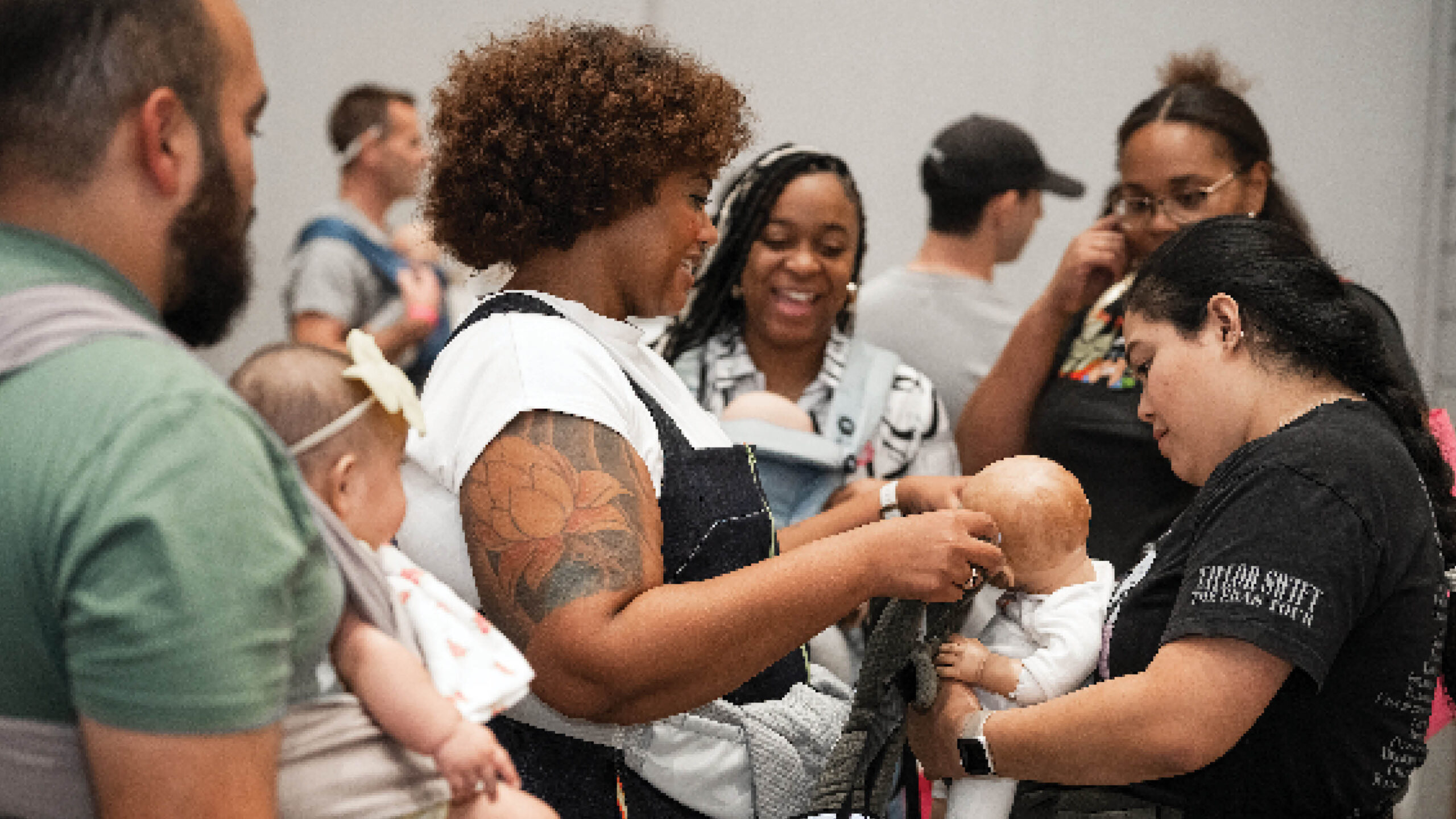 Attendees Trying Babywearing at B&B