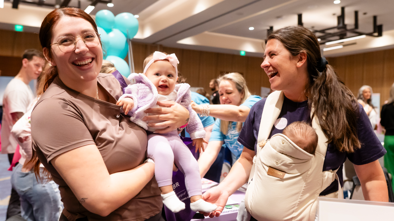 Friends and babies on the exhibitor floor on event day